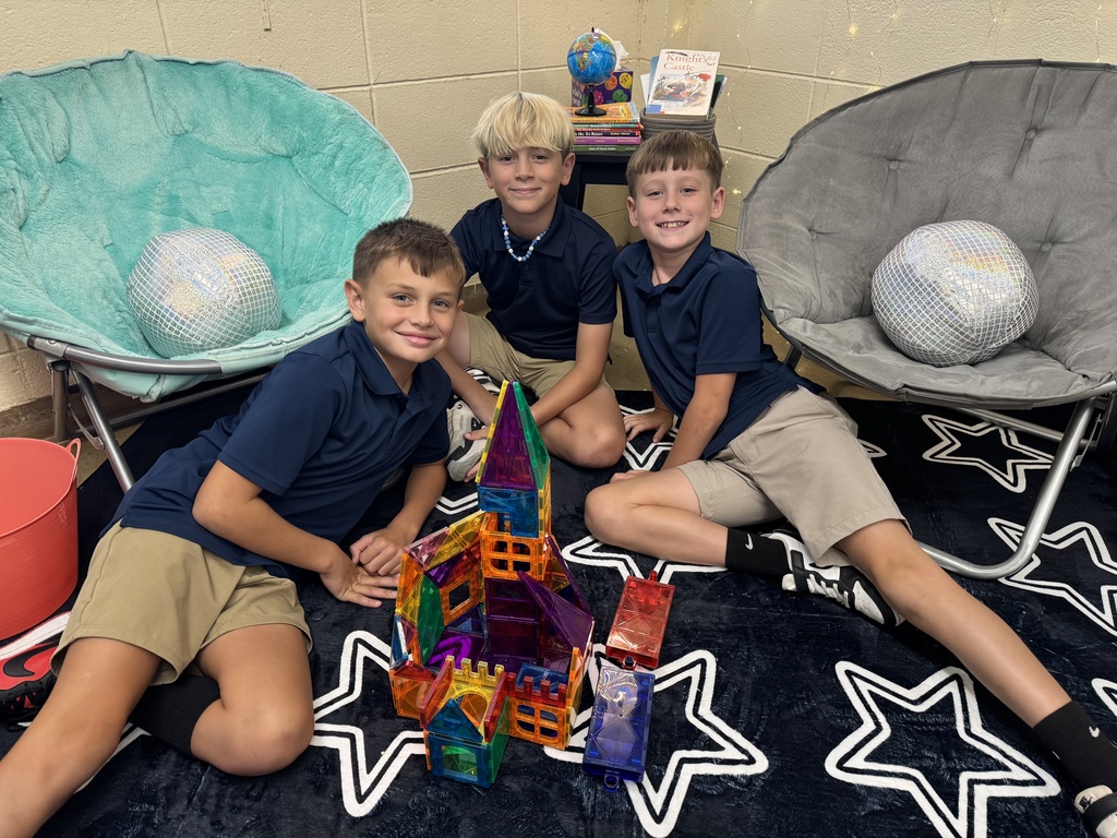 Students smiling and collaborating.