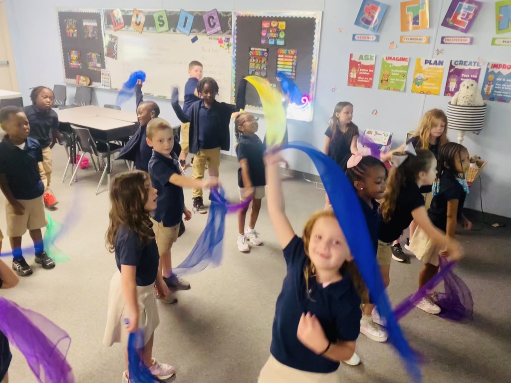 Students dancing with ribbons