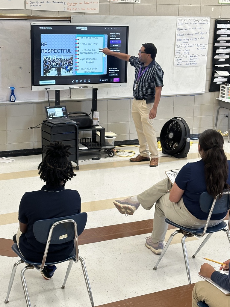 Students listen to a teacher.