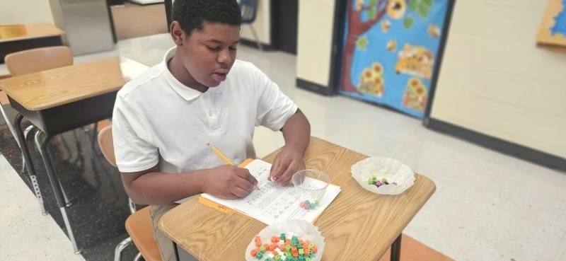 A student conducts an experiment.