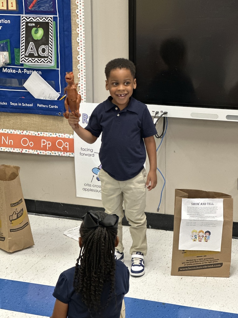 A student shares a dinosaur.