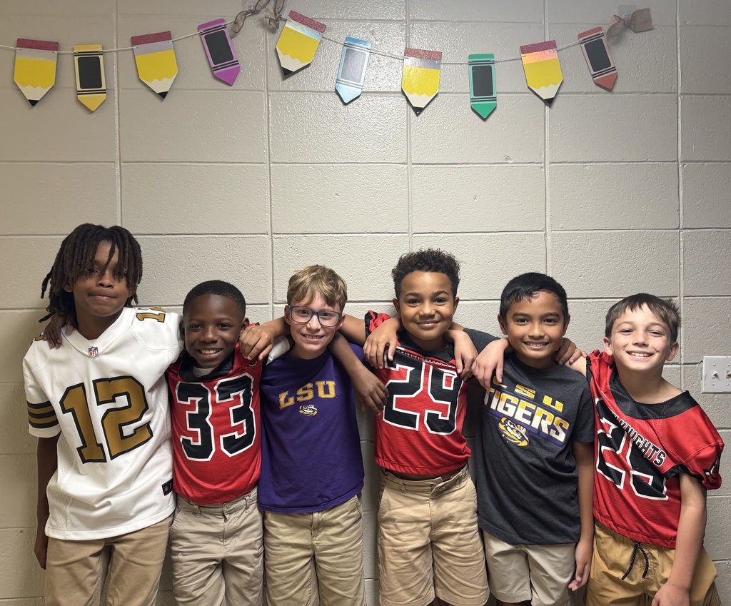 Smiling students with jerseys