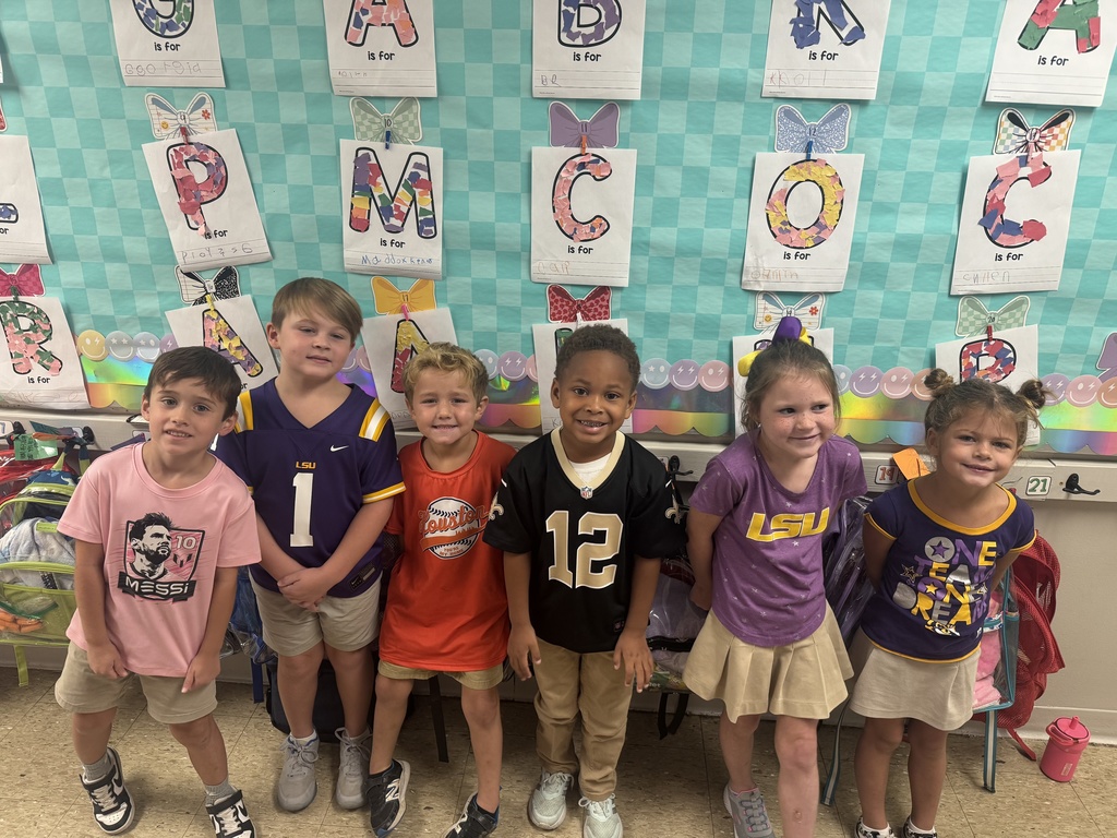 Smiling students with jerseys