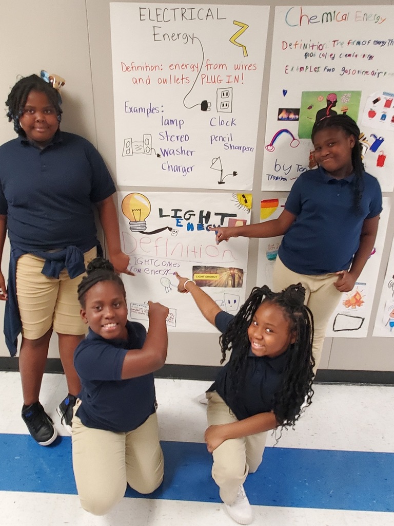 Students highighting a poster they designed.