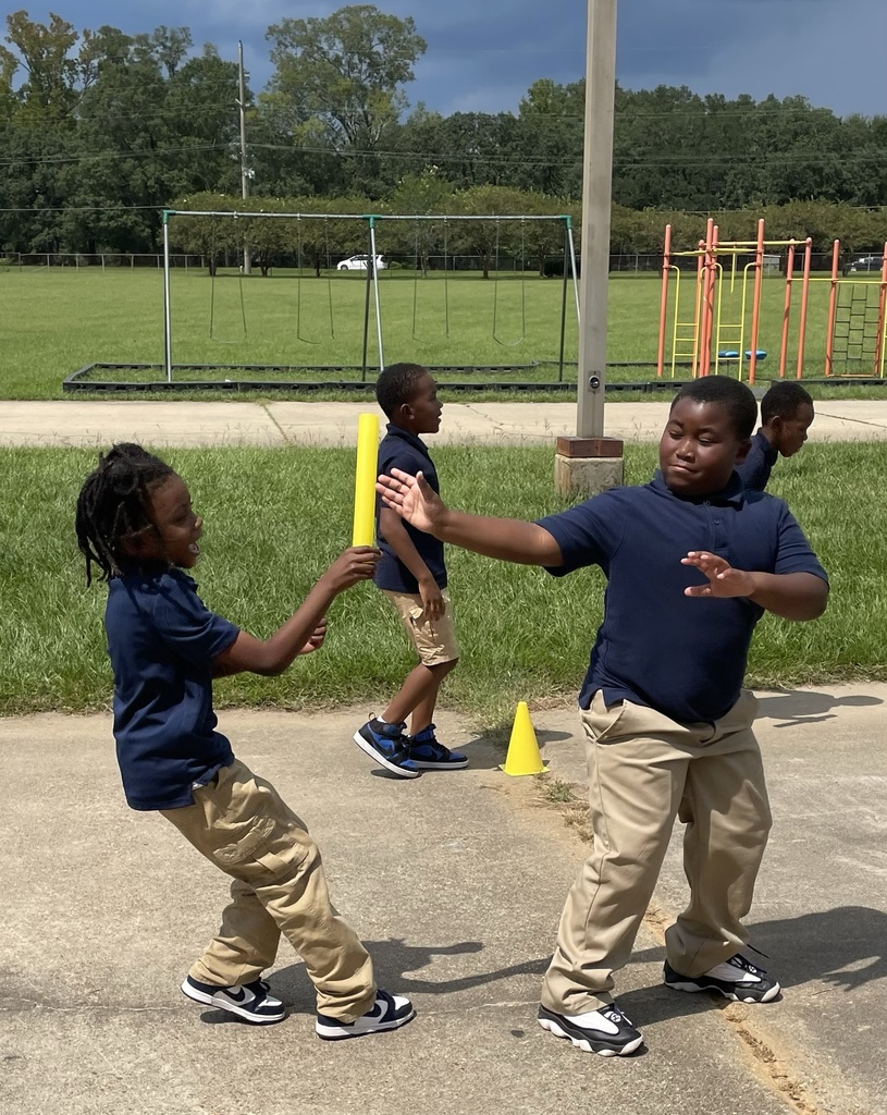 Students participate in a relay race.