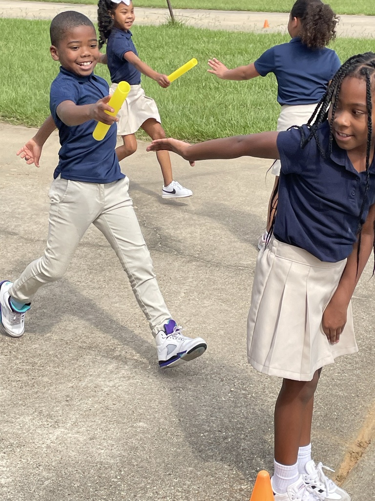 Students participate in a relay race.