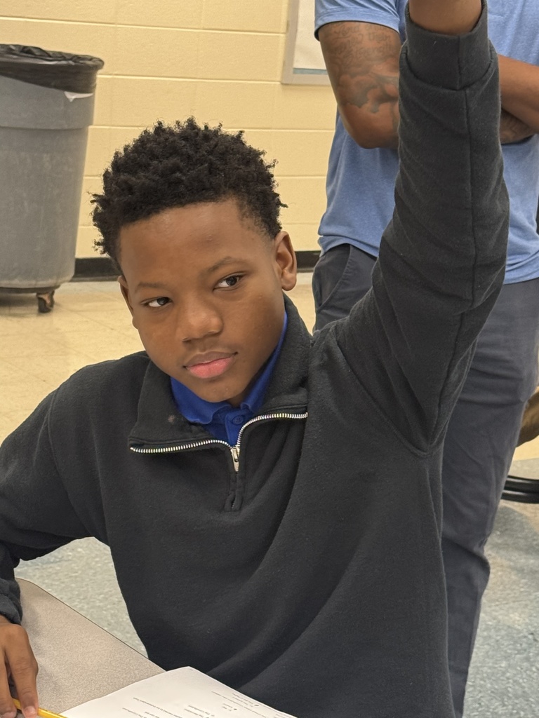Student raising their hand.