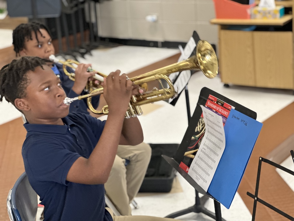 Students playing trumpets.