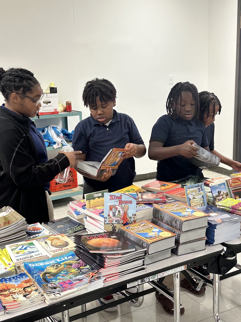 Students looking at books.