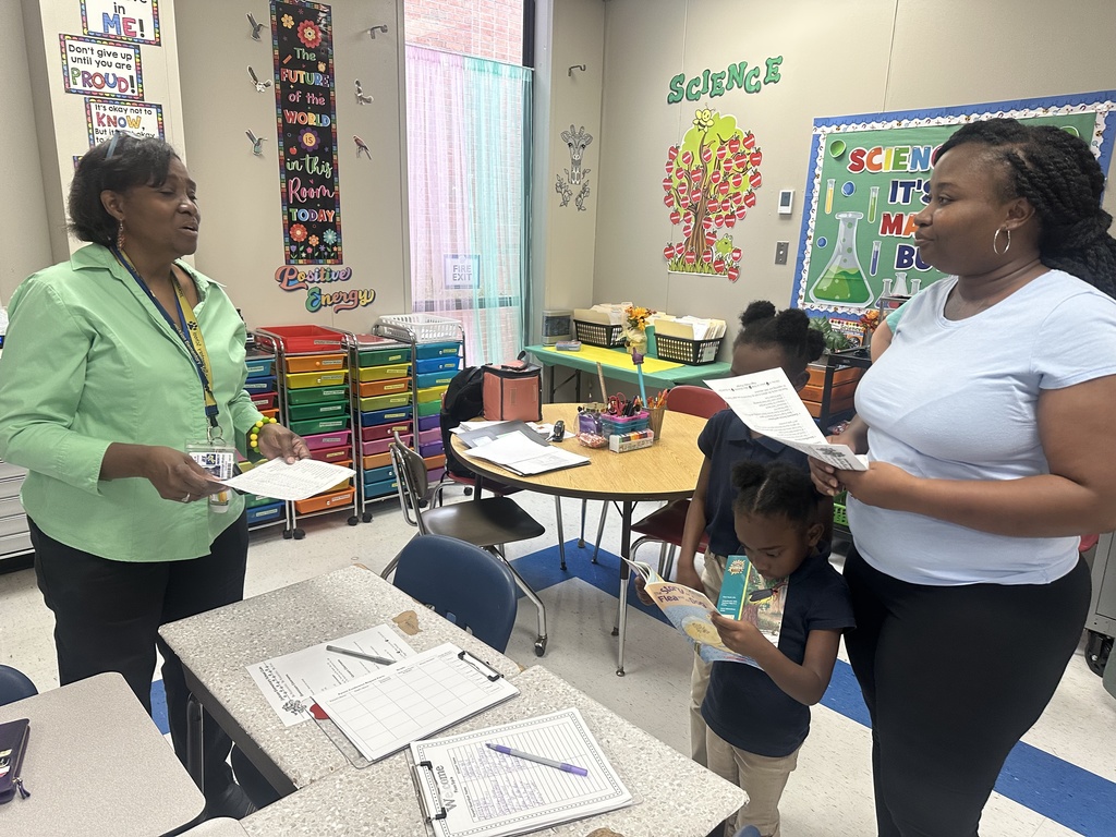 A teacher and a parent are talking.