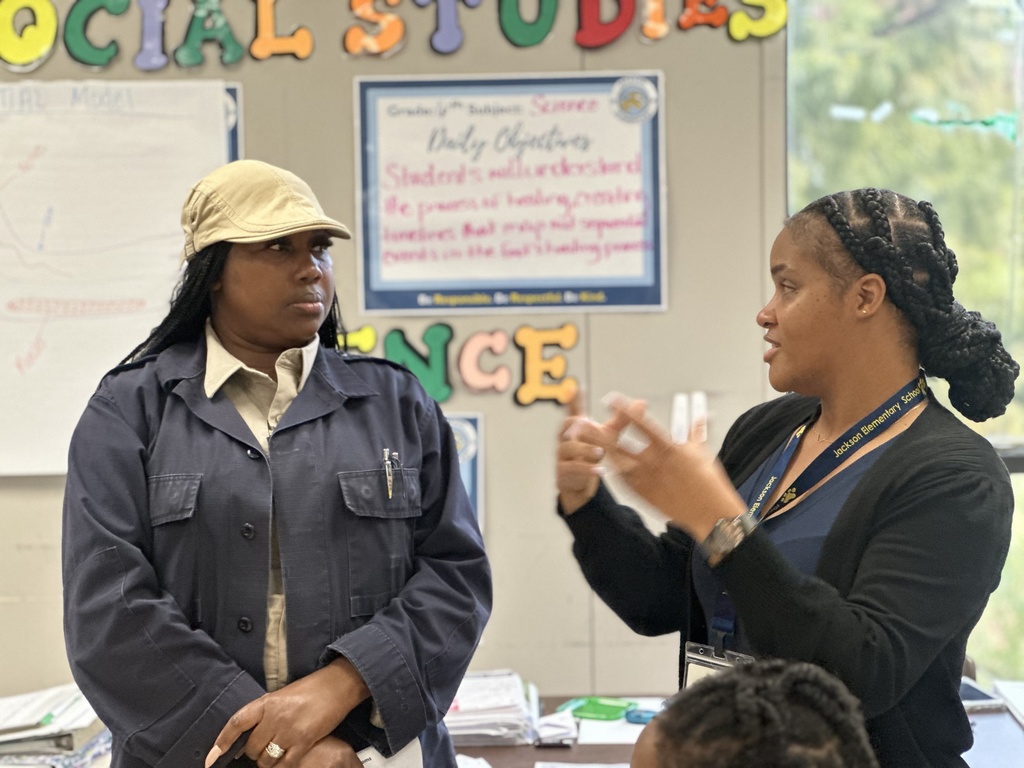 A parent and a teacher are talking.