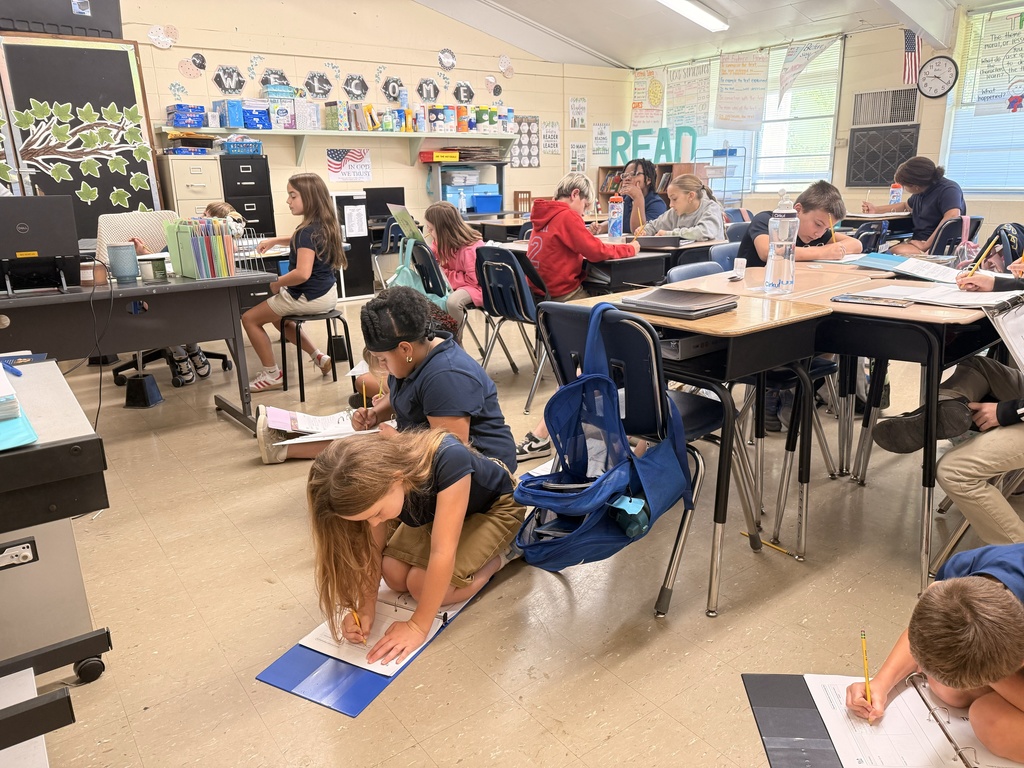 Students diligently at work in an English language arts classroom.