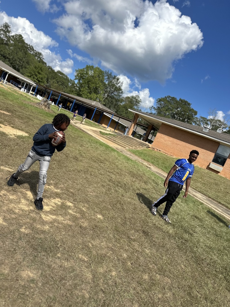 Students throwing a football.