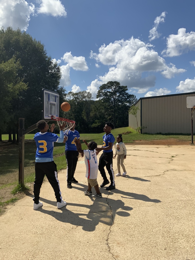 Students playing basketball.