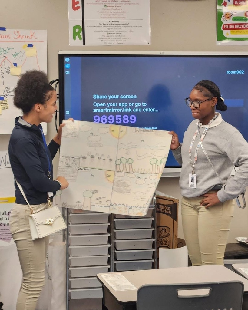 Students with displays.