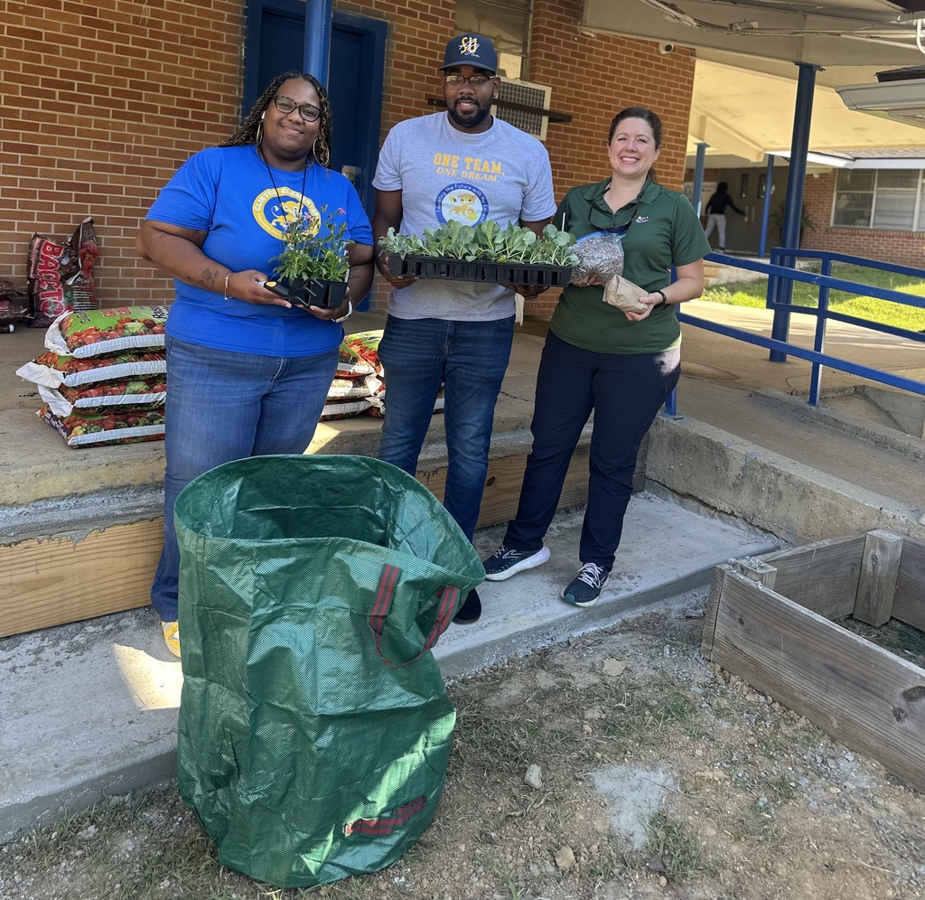 Three adults with gardening materials.