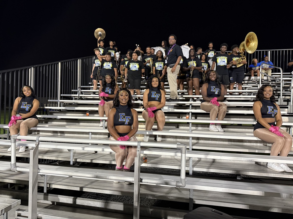 Band and dancers in the stands.