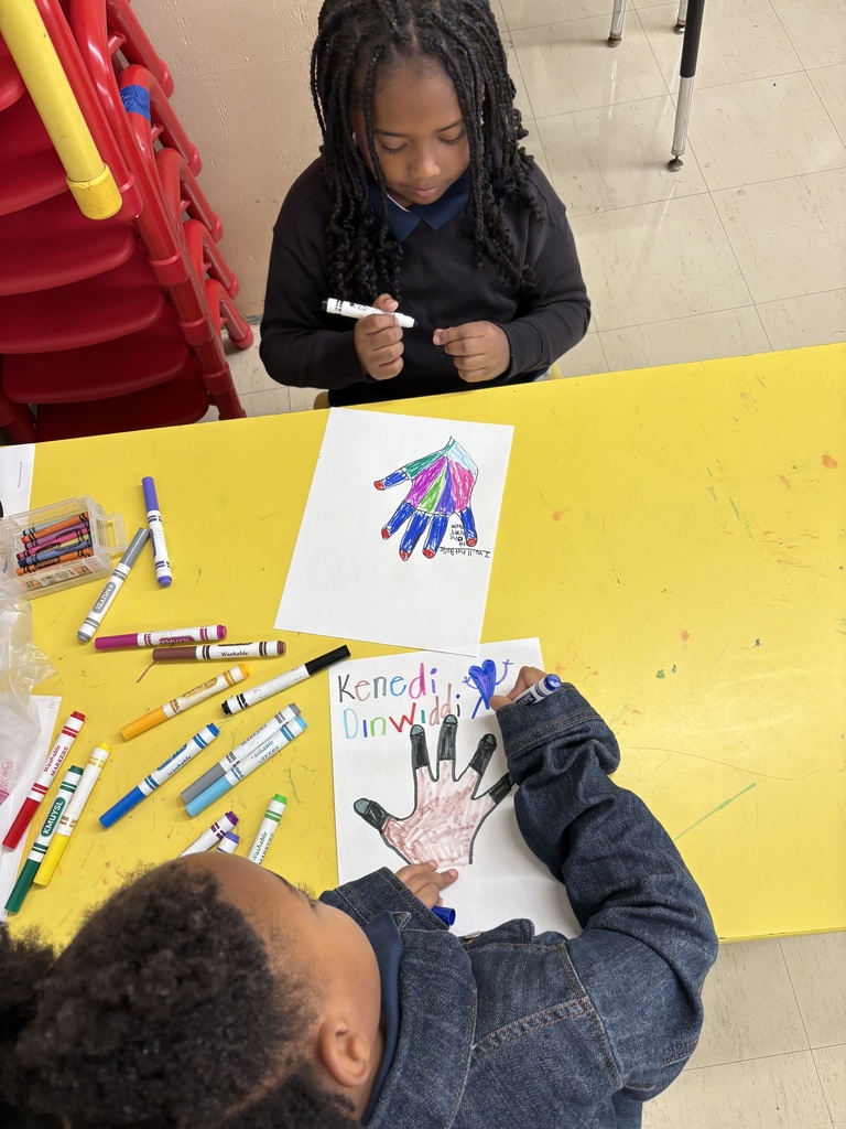 Students making hand art.