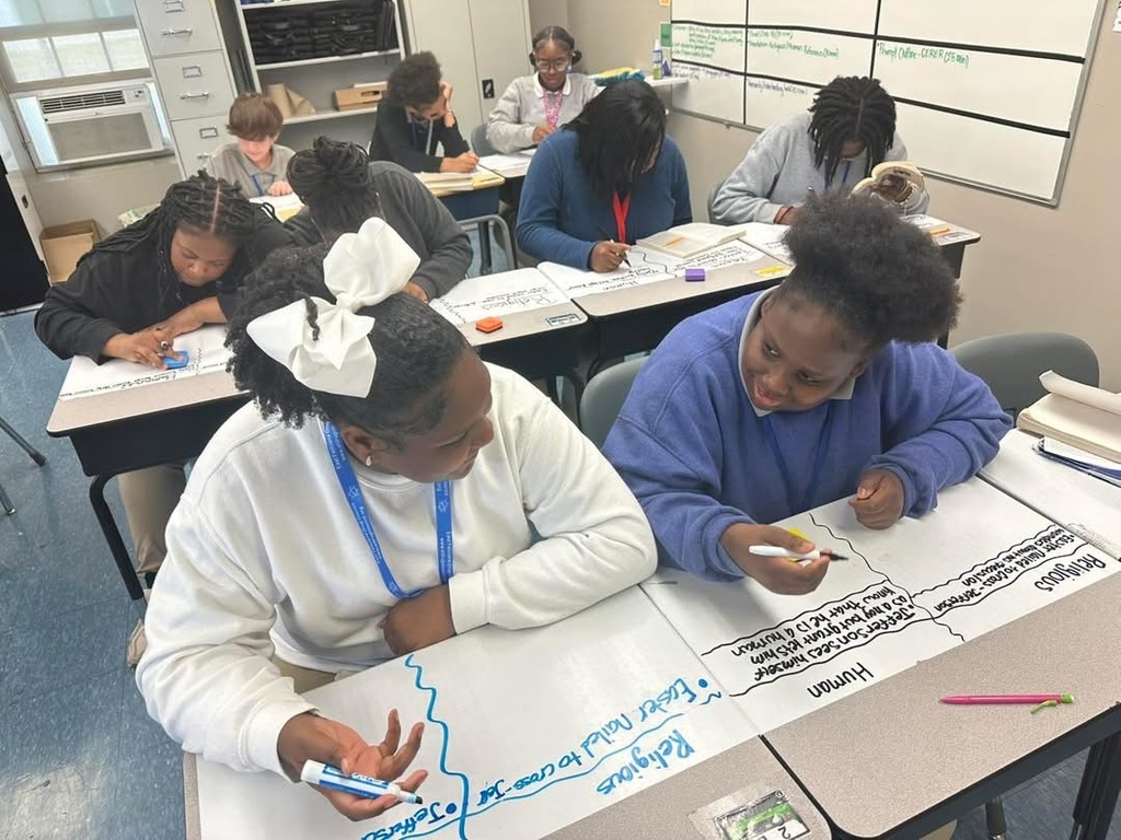 Students reading and taking notes together.