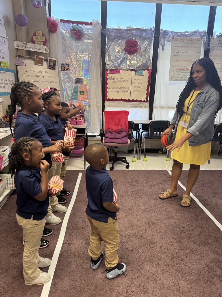 A teacher gives directions to children.