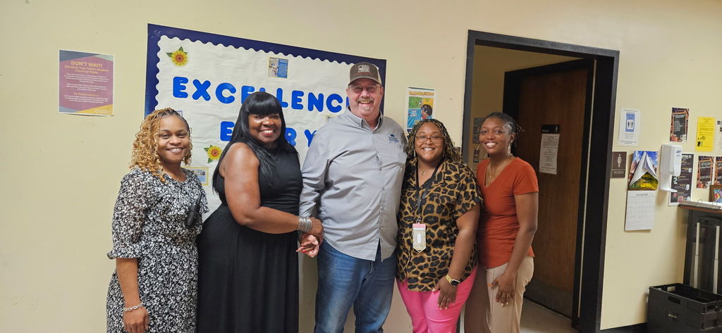 A group of smiling leaders.