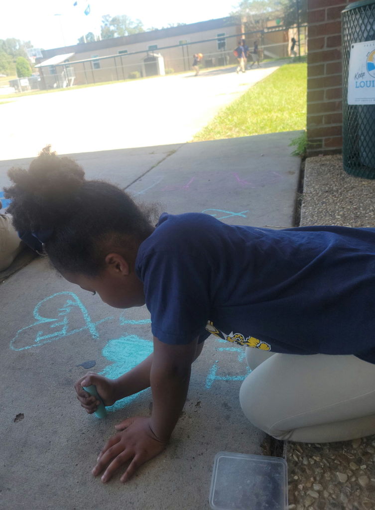 Student with a chalk message.