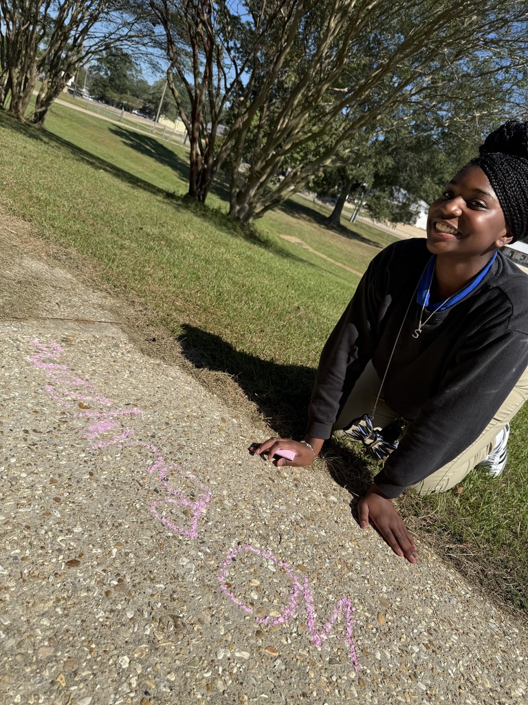 Student with a chalk message.