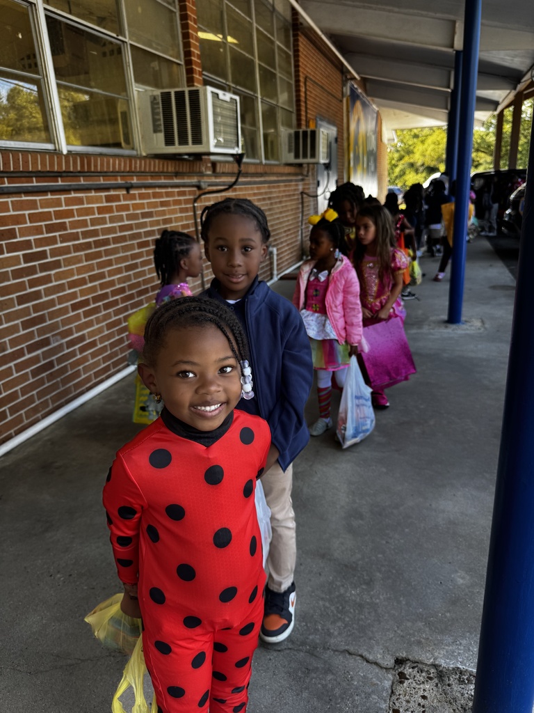 Children in costumes smiling