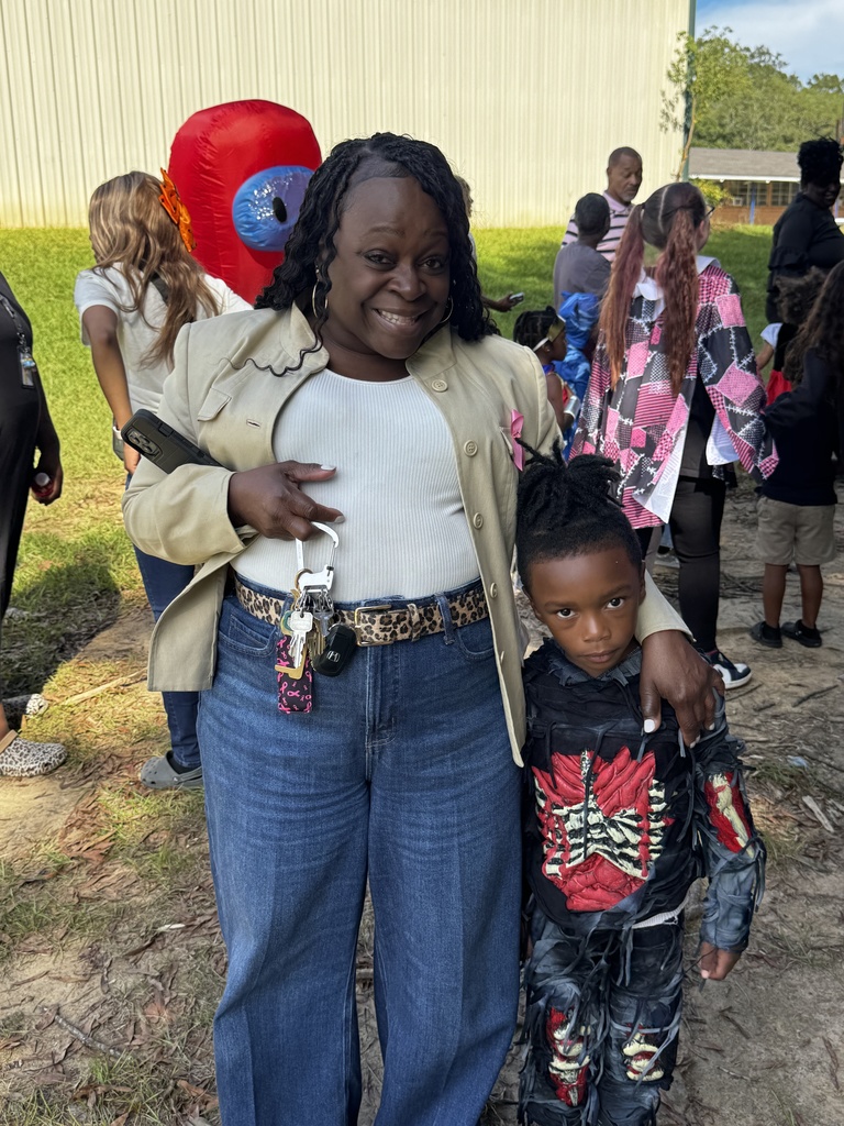 A woman and a child smiling.