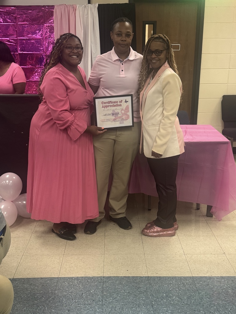 Three women with a certificate.