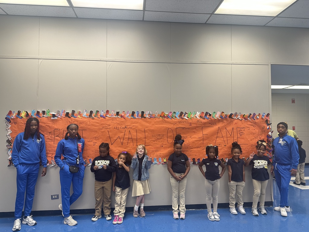 JES students and EFHS band members with boot banner.