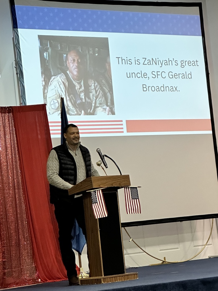 Veteran speaking at a podium.