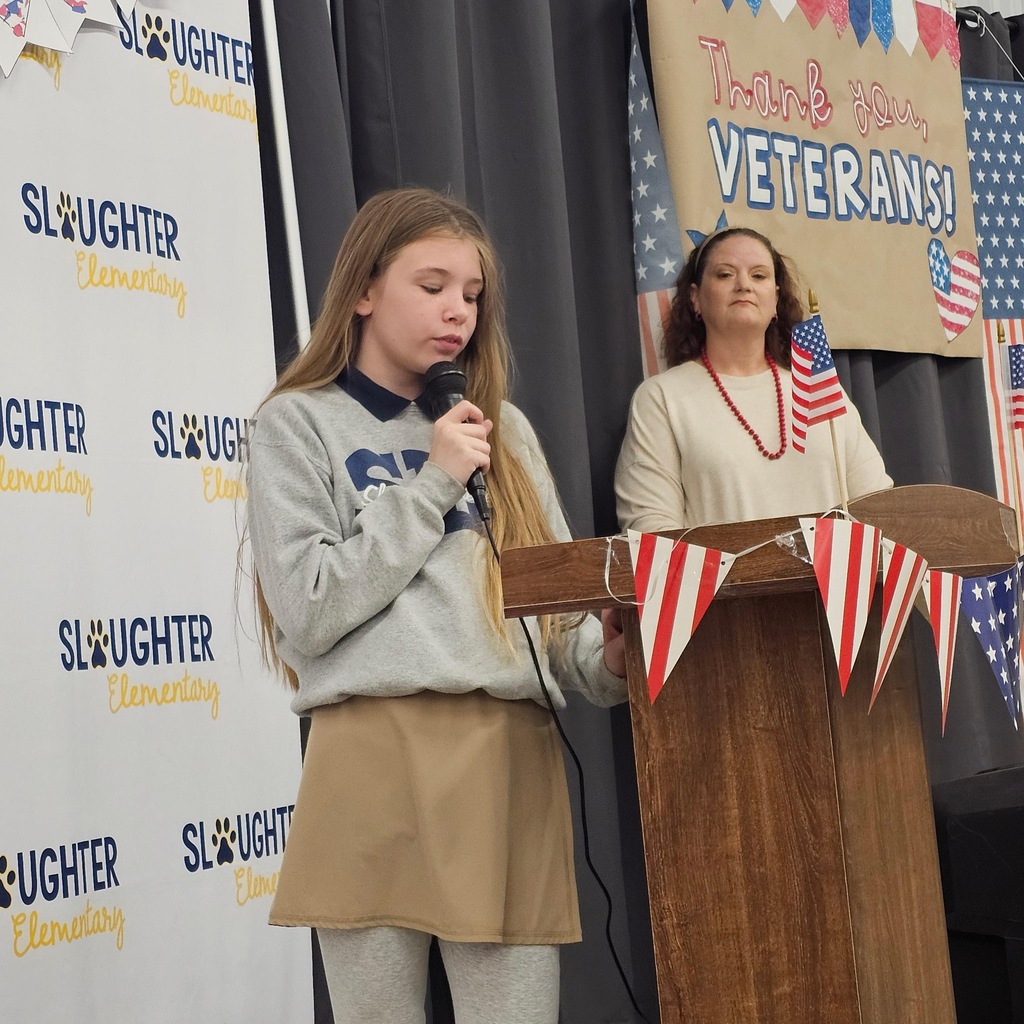 A student speaks at a Veterans Day program.