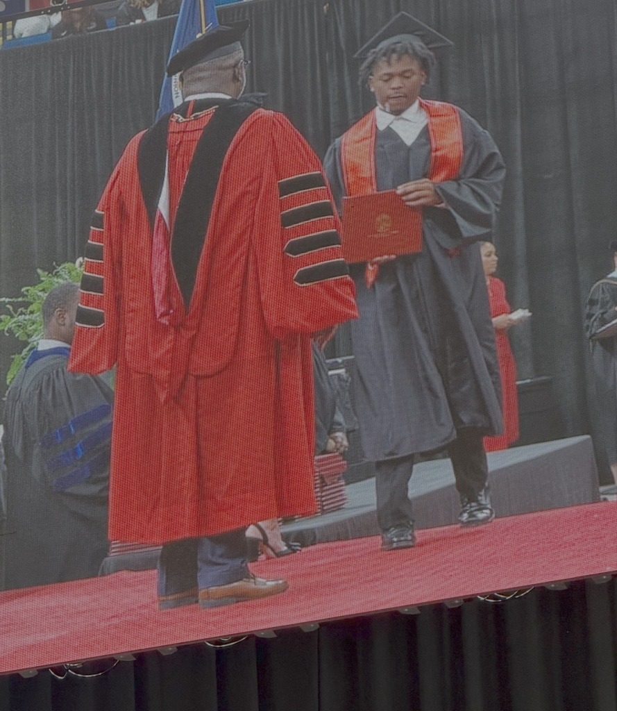 Student receiving a diploma.