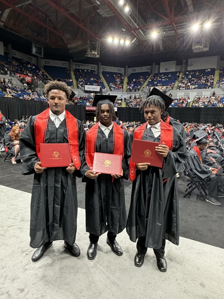 Three students receiving technical diploma.