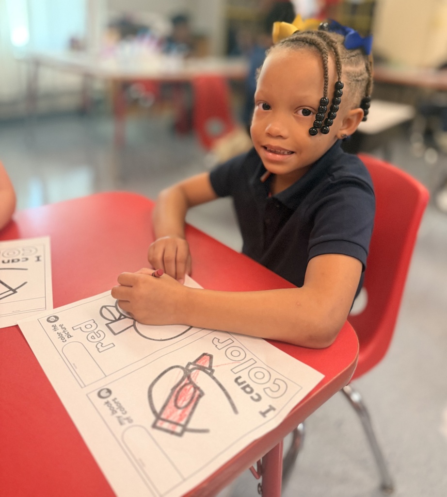 A student coloring a picture