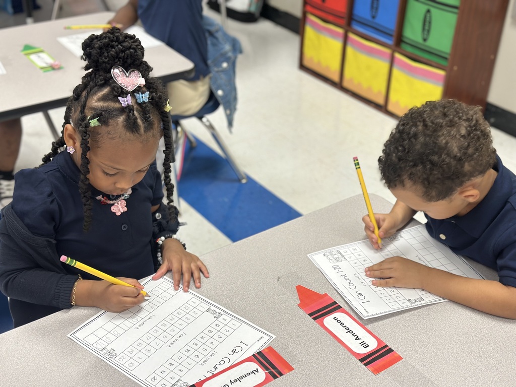 Two students are writing