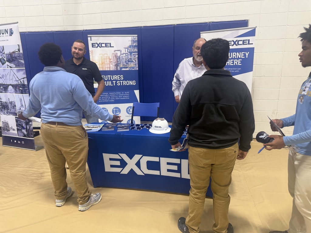Students talk to a career vendor.