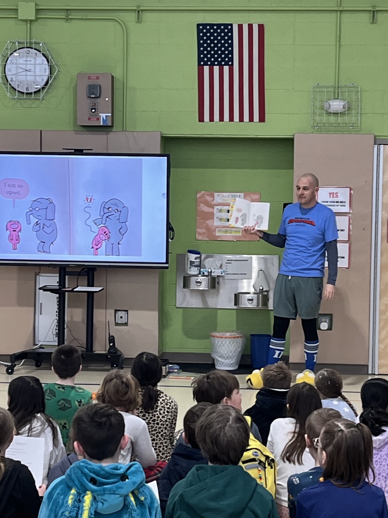 Mr. Lowman leading our All School Meeting