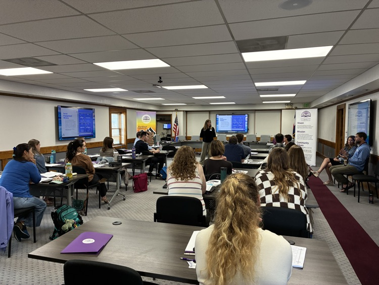 teachers sitting at desks for professional learning