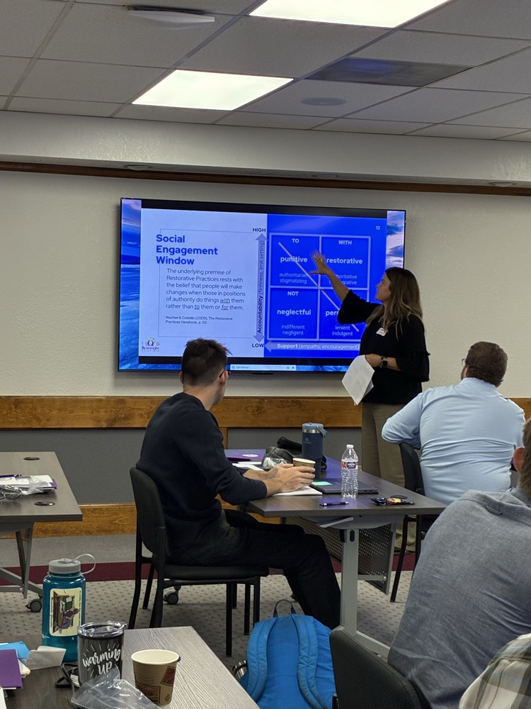 professional learning presenter in front of screen
