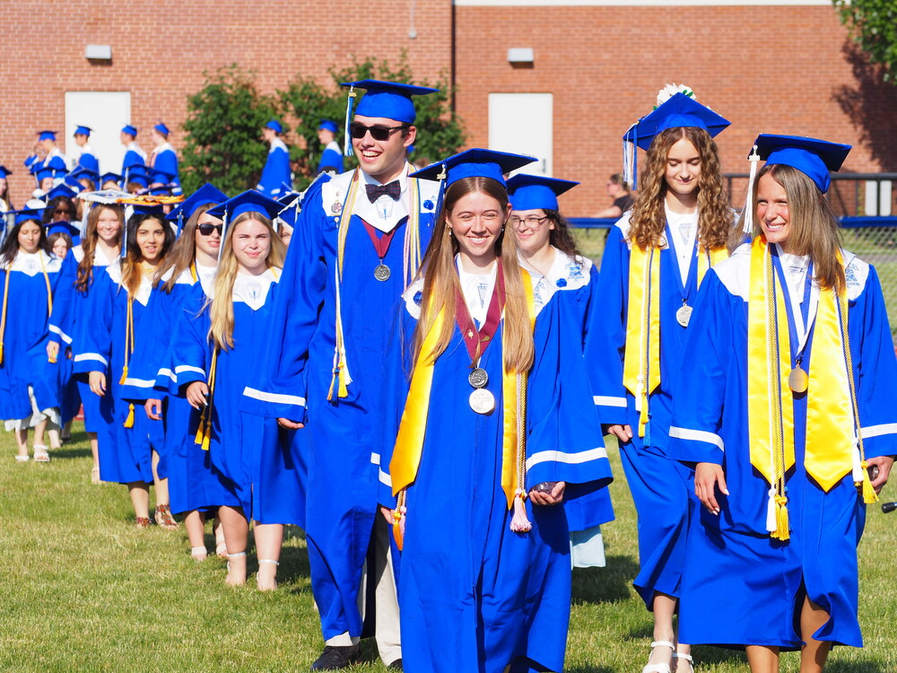 Graduates walking in the graduation processional