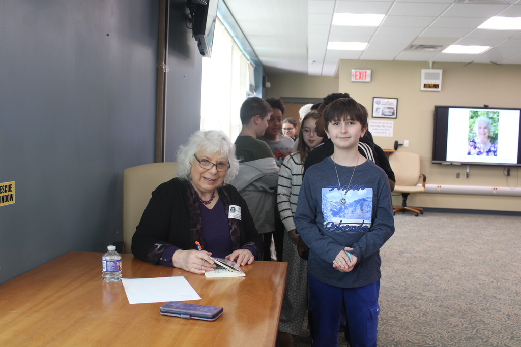 students getting book signed