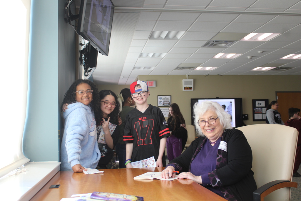 students getting book signed
