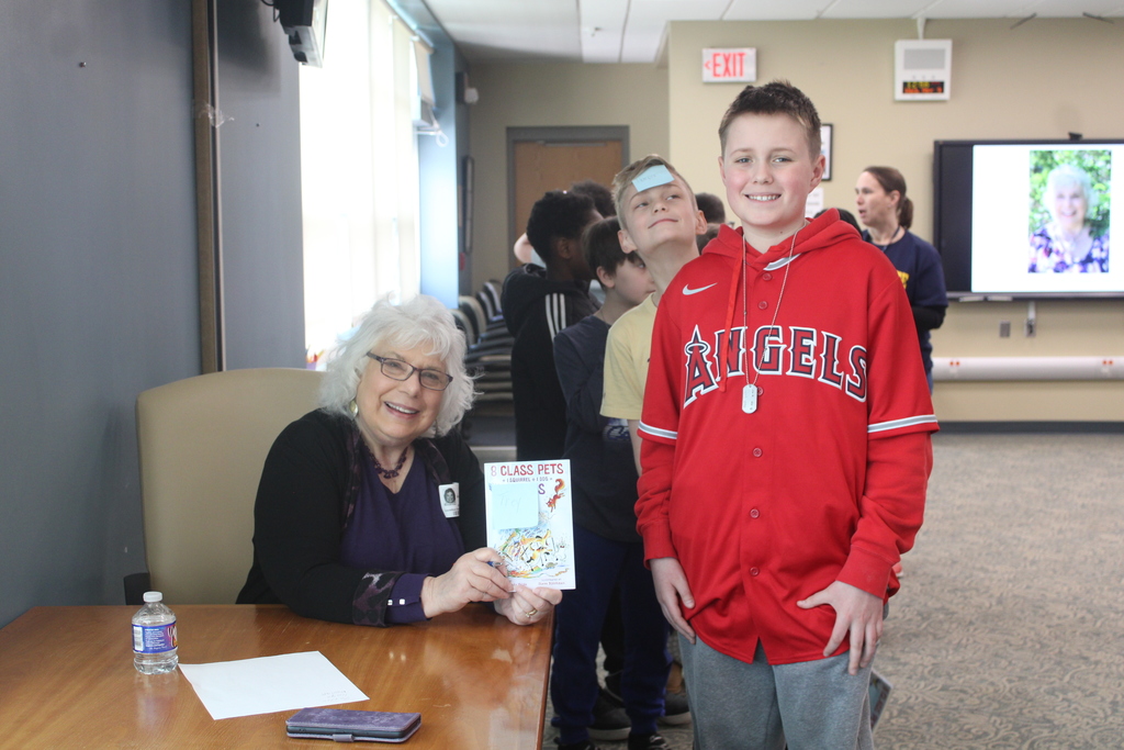 students getting book signed
