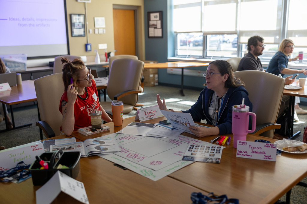 teachers working on their poster and presenting them