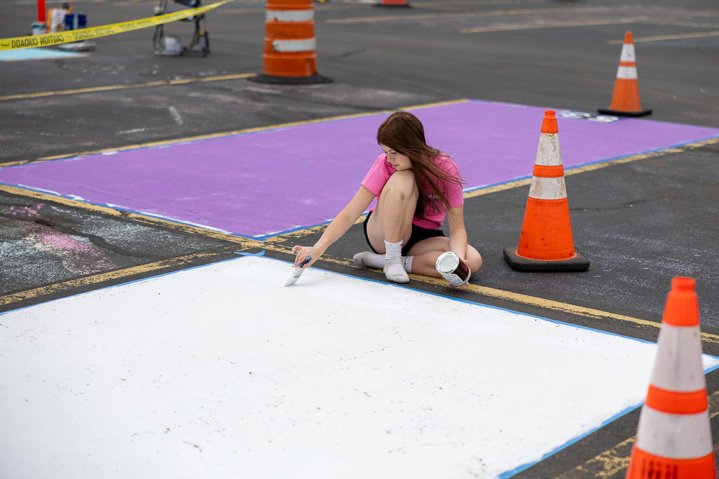 students painting their parking spot