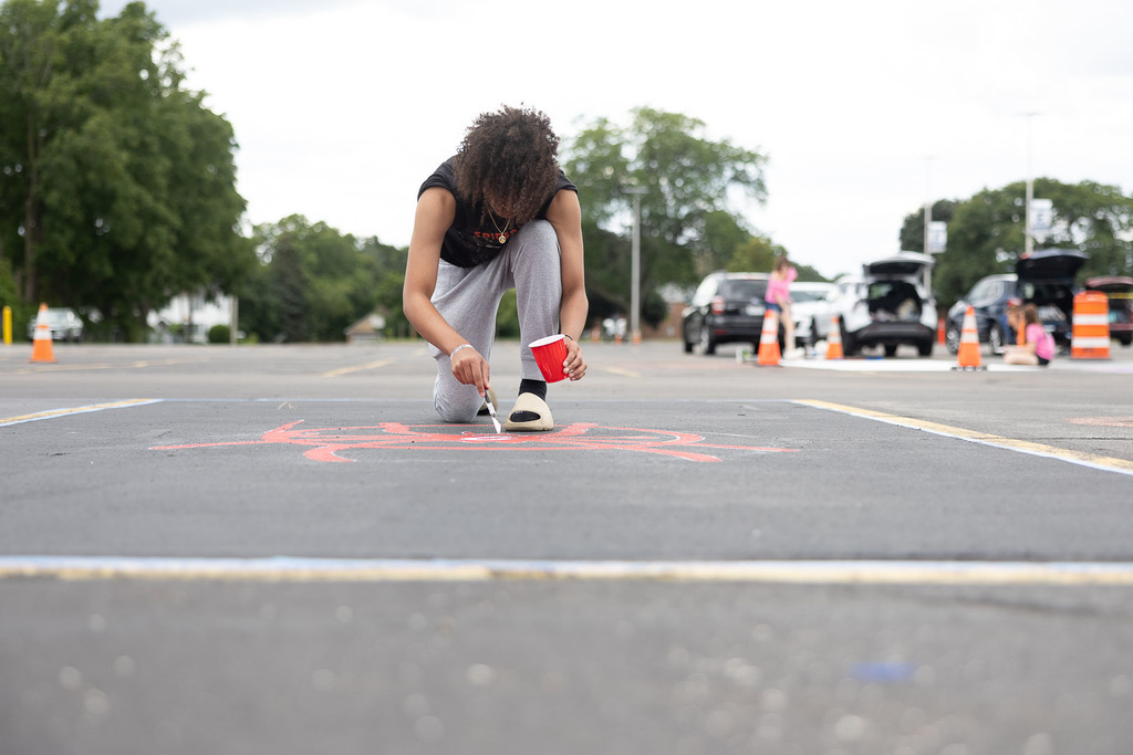 students painting their parking spot