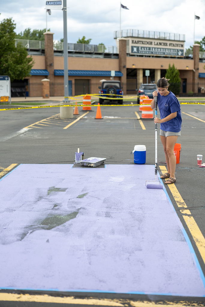students painting their parking spot