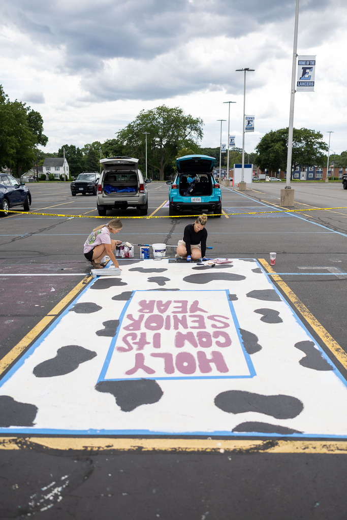 students painting their parking spot